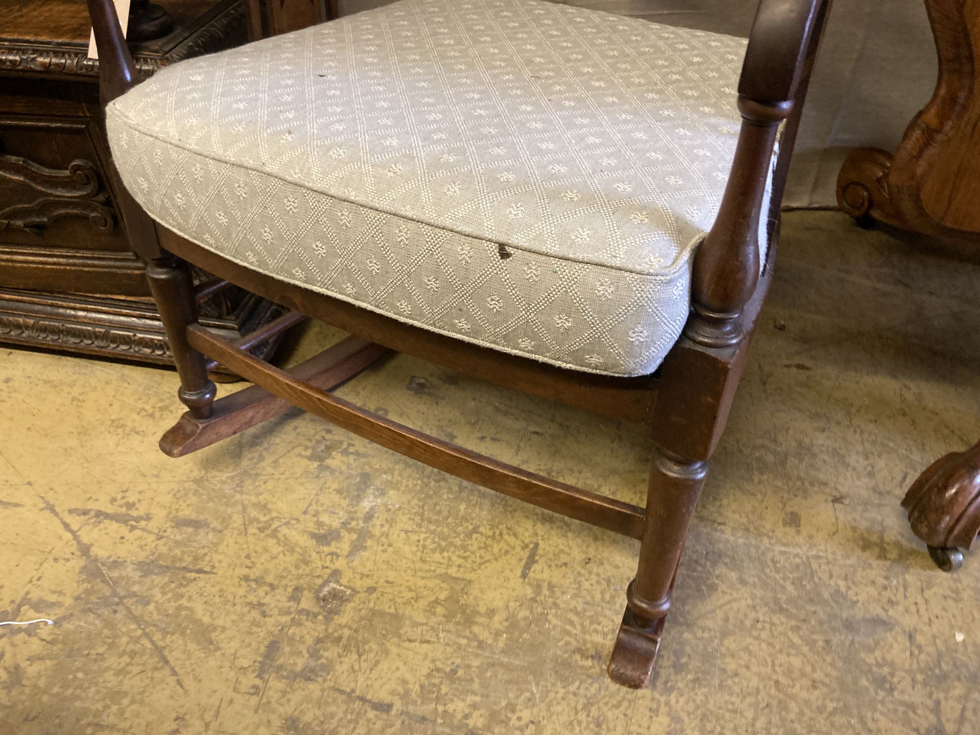 An Edwardian satinwood banded mahogany rocking chair